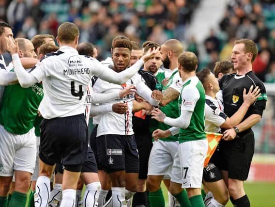 Hibs and Falkirk players clash as Bairns midfielder Tom Taiwo is sent off after only 24 minutes at Easter Road