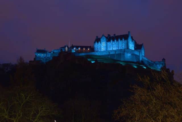 Edinburgh Castle lit up in blue during a global initiative to turn the World UN Blue.