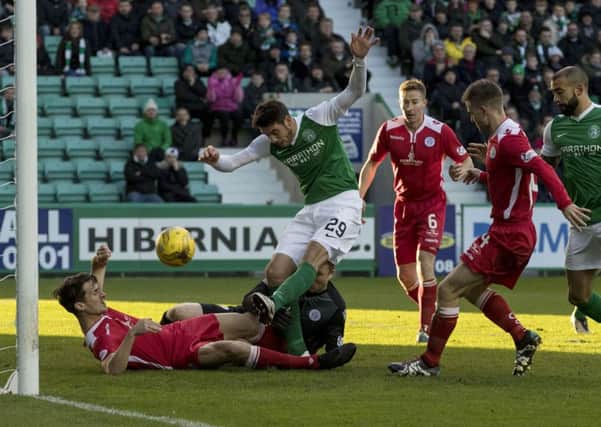 Brian Graham smashes the ball home to give Hibs an early lead