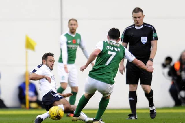 Tom Taiwo was sent off for this challenge on Hibs midfielder John McGinn