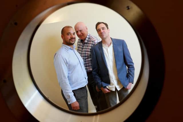 DAC boss Norm Hagarty, centre, with Ambergreen's Tino Nombro, left, and Grant Whiteside. Picture: Stewart Attwood