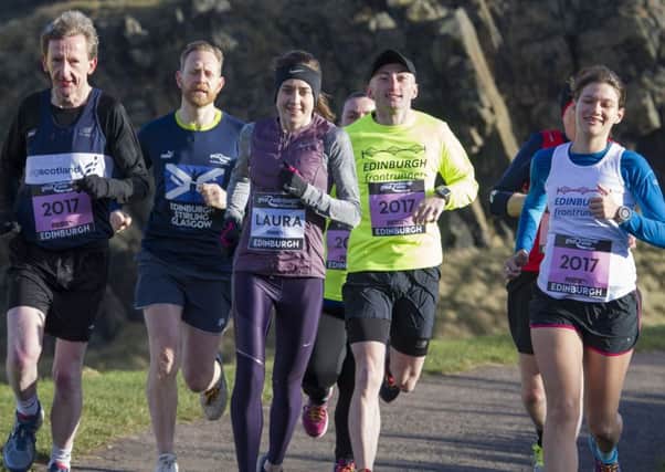 Laura Muir, centre, joined local members of the JogScotland running group in Holyrood Park. They will all will be taking on the Great Winter Run in January. Picture: Ian Rutherford