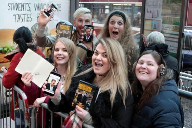 Fans wait for Hollywood A-Lister Leonardo DiCaprio to arrive at Home Restaurant in Edinburgh, owned by Social Bite, where he will meet and feed homeless.