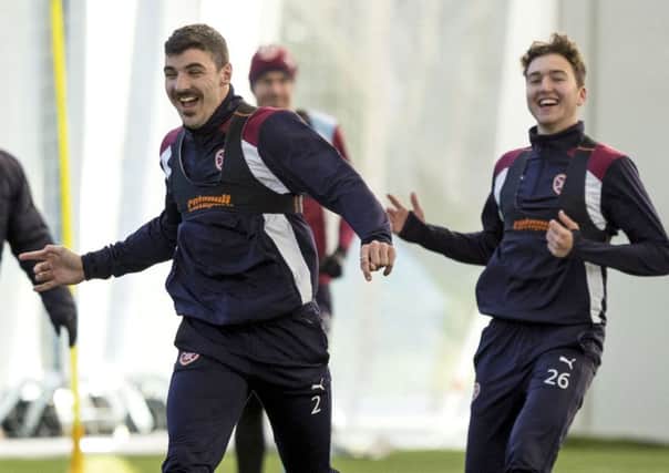 Callum Paterson, pictured in training ahead of Monday's match at Hamilton, has backed Scotland boss Gordon Strachan, below