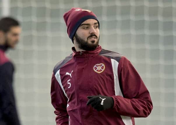 Alim Ozturk is poised to play in central defence for Hearts