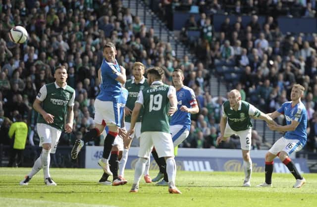 Niklas Gunnarsson, centre, was in the thick of the action as David Gray, second right, headed home Hibs winner in the Scottish Cup final. Picture: Neil Hanna