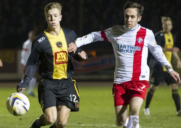 David Gold of Berwick battles with Jack Beesley in their 2015 fifth-round tie