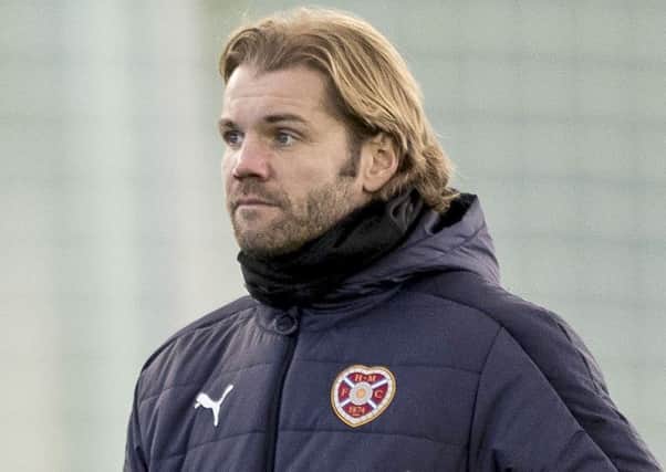 Head coach Robbie Neilson believes playing three centre-halves gives Hearts 'security'
