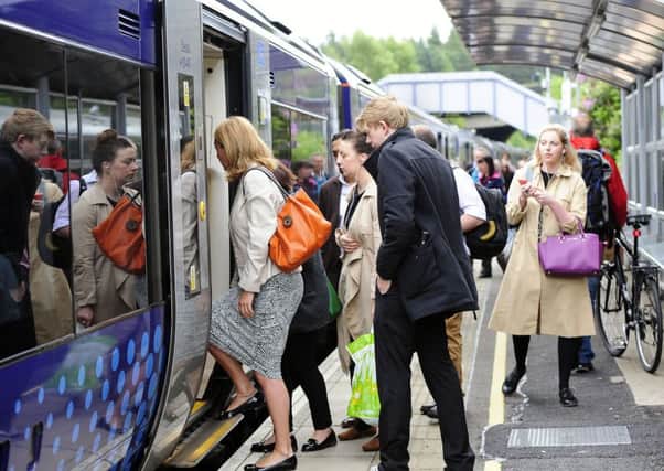 Passengers board at Falkirk High station. Photograph: Michael Gillen