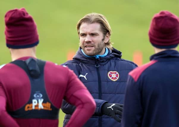 Robbie Neilson briefs his squad in training ahead of what could be his final match in charge, tomorrow's home game with Rangers
