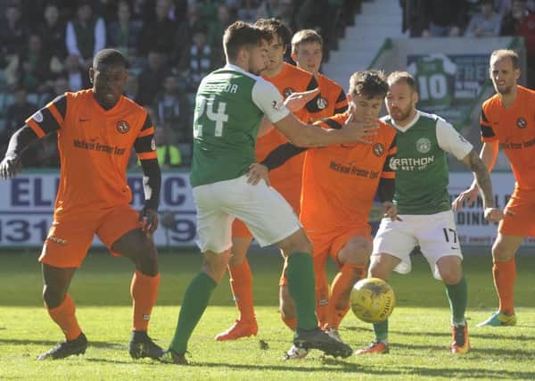 Darren McGregor in the thick of the action during the 1-1 draw with United at Easter Road in October