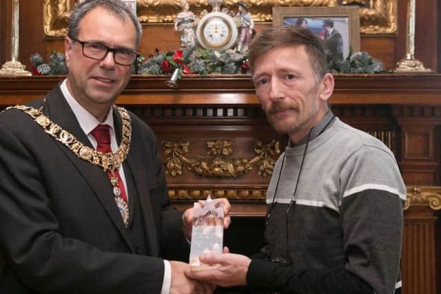 Alistair Blakey is congratulated by the Lord Provost.