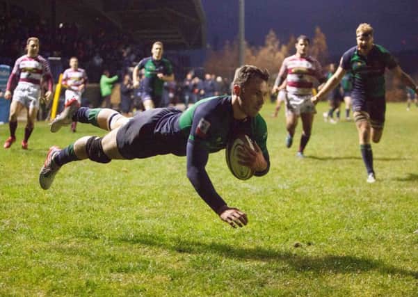 Jordan Edmunds flies over the whitewash for Boroughmuir in the second half. Pic: Toby Williams