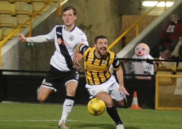 Edinburgh City's Aaron Dunsmore challenges East Fife's Scott Robinson for possession. Pic: George McLuskie