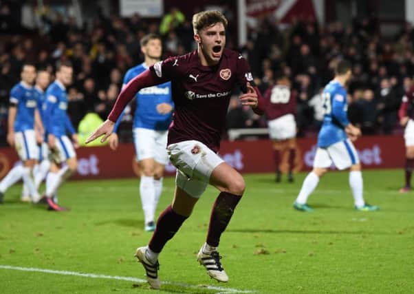 Robbie Muirhead celebrates after putting Hearts ahead