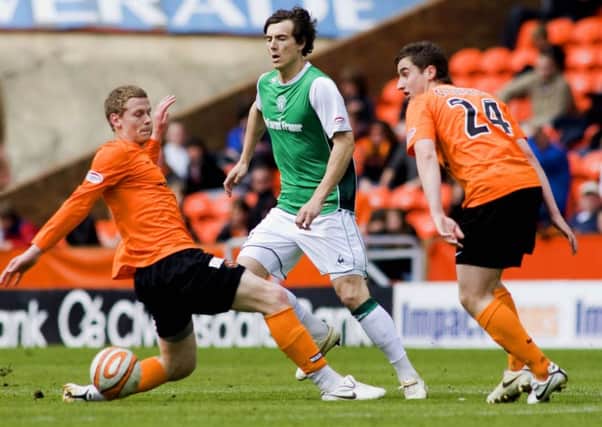 Scott Robertson gets stuck in for Dundee United against his future club Hibs in 2010