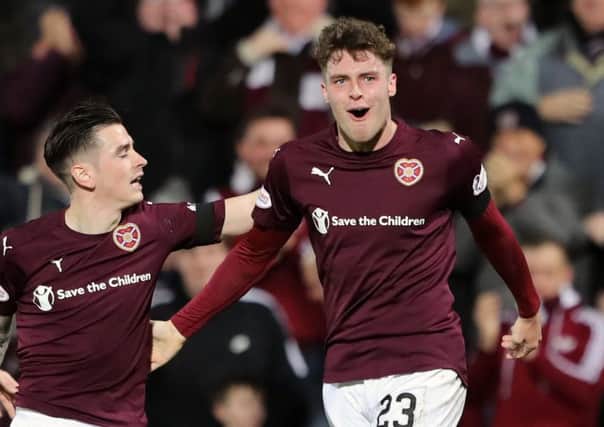 Robbie Muirhead, right, celebrates his first goal with Hearts team-mate Jamie Walker