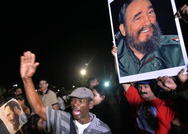 People gather to witness the ashes of Cuban revolutionary leader Fidel Castro being transported past in a farewell procession. Picture; Getty