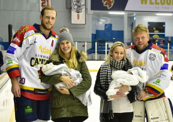 DADDIES COOL: Jared Staal and wife Natalie with baby Hudson are pictured left on the ice at Murrayfield with, on the far right, Kevin Forshall, his partner Leona Barnes and baby Layla. Pic: SMP