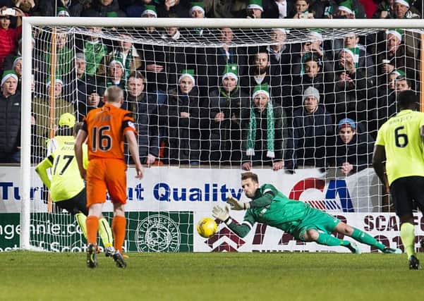 Dundee United's Cammy Bell saves the penalty from Martin Boyle (No.17)