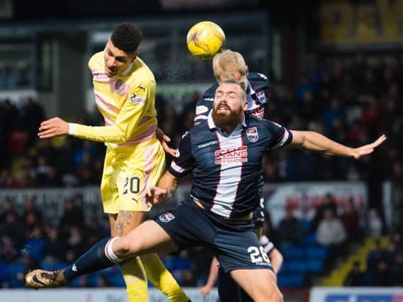 Hearts' striker Bjorn Johnsen challenges during a frantic match in Dingwall