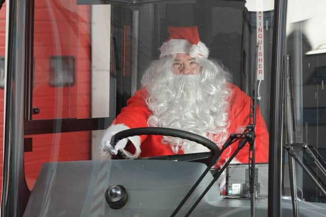 Santa driving his LRT bus.  Picture: Neil Hanna