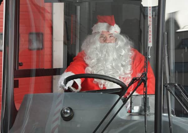 Santa driving his LRT bus.  Picture: Neil Hanna