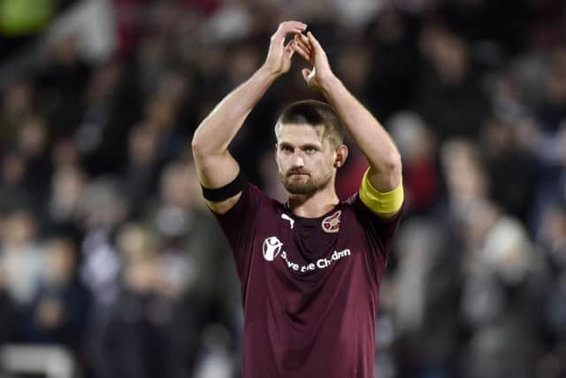 Hearts captain Perry Kitchen salutes the fans who made the long trek north and saw their team put up a tremendous fight against Ross County