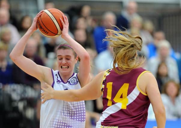 Hannah Peacock tries to get past a Cardiff opponent. Peacock scored 10 points with nine rebounds