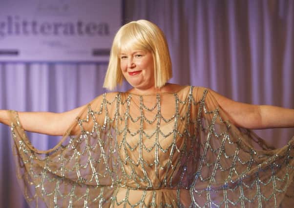 Breast cancer patient Lesley Stephen, pictured on the catwalk at Lisa's Glitteratea fundraising event for Maggie's. Picture Toby Williams