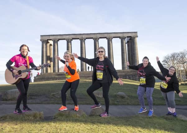 Sing in the City, from left, Annette Hanley, kirsty Baird, Vicky Lee, Lisa Ward and Irene Donaldson, warm up in Holyrood Park ahead of the Great Edinburgh Winter Run. Picture: Jeff Holmes