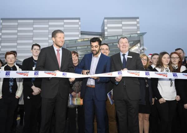 Transport Minister Humza Yousaf officially opens the Edinburgh Gateway station at Gogarburns - 
with Phil Verster (MD Scotrail Alliance) and Rodger Querns (Regional Director Network Rail), right. Picture: Greg Macvean