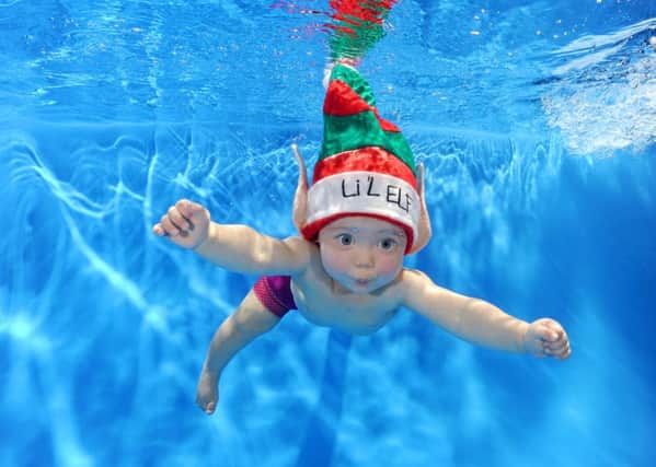 13-month-old Chloe Leslie bears more than a passing resemblance to the famous baby on Nirvana's Nevermind record. Picture: Sarah Guilar
