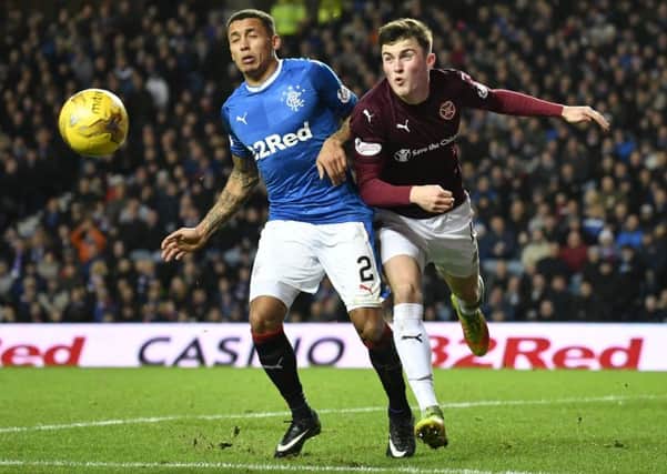 John Souttar battles with Rangers defender James Tavernier at Ibrox. Souttar says Hearts need to react in a positive way against Partick