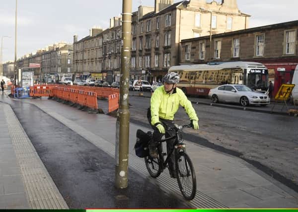A new cycle lane on Leith Walk on the pavement which has a lamp post in the middle of it. Picture; Greg Macvean