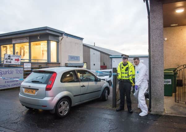 Police investagte a crime scene outside the Asylum gym on king street bathgate
