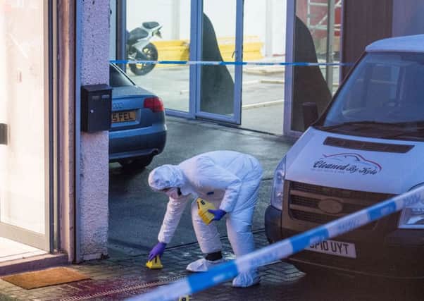 Police investagte a crime scene outside the Asylum gym on king street bathgate. Picture; Ian Georgeson