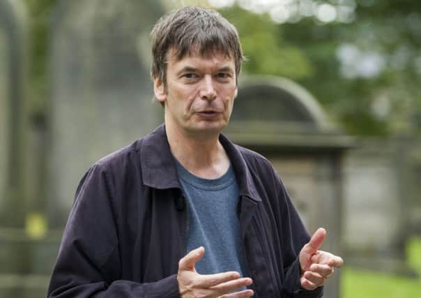 Author Ian Rankin speaks to group in Greyfriars Churchyard during a tour around Edinburgh's Old Town  to raise money/awareness for Maggies Centres.