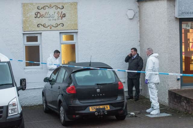 Police investagte a crime scene outside the Asylum gym on king street bathgate