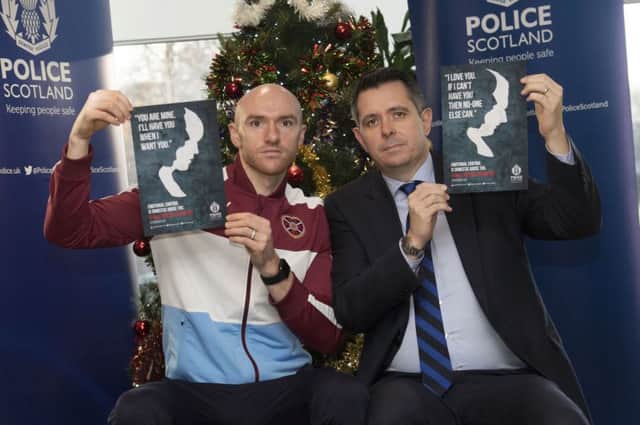 Hearts' Conor Sammon and Detective Superintendent David Gordon promote Police Scotland's anti-domestic Abuse campaign. Picture: SNS