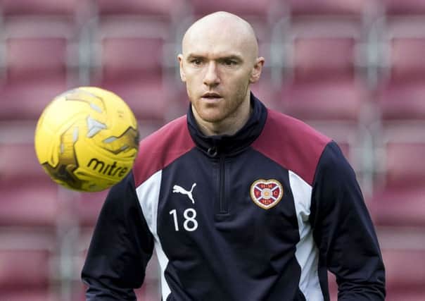 Conor Sammon has been impressed by head coach Ian Cathro, below, as he settles into Hearts