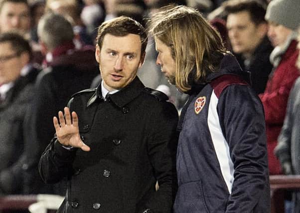 Head coach Ian Cathro, pictured with No.2 Austin MacPhee, felt the loss of Prince Buaben, below, to injury affected Hearts against Partick