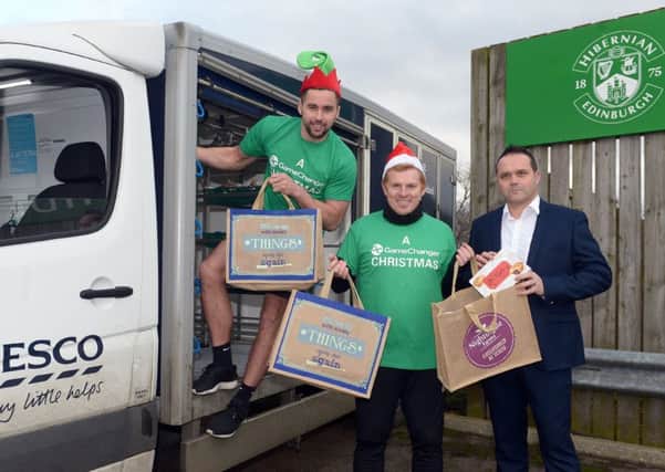Easter Road defender Darren McGregor, head coach Neil Lennon and Tesco Leith store manager Fraser Cromar helped launch a partnership with the Hibs Community Foundation to deliver Christmas lunch to those in need this year. Pic: Neil Hanna