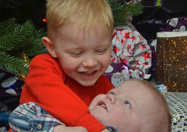 Chris, 3, and Lyle, 1, who is suffering from a severe brain tumour.