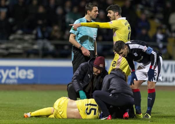 Hearts fell apart following the injury suffered by Don Cowie early in the second half at Dens Park