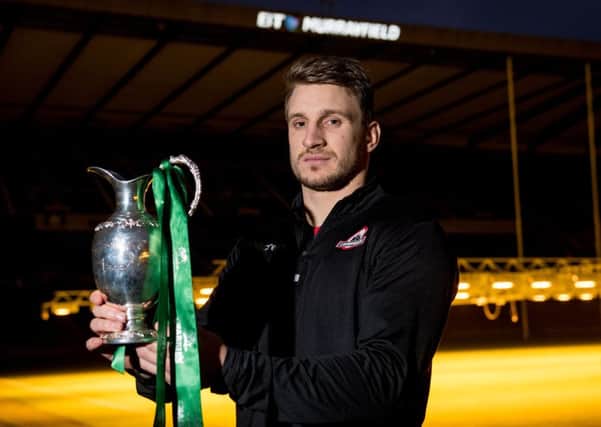 Edinburgh's Tom Brown with the 1872 Cup. Pic: SNS