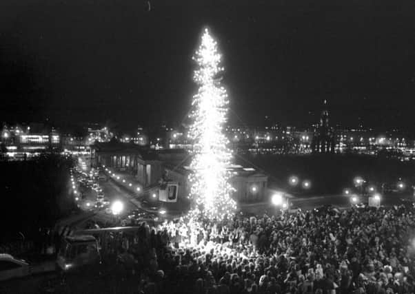 Crowds gather at The Mound in Edinburgh to watch the lights of the Norwegian Christmas tree being switched on, December 1988. Picture: TSPL