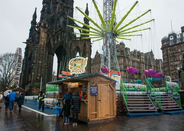 Edinburgh's Christmas is back on despite the bad weather. Picture: Ian Georgeson