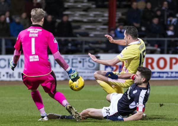 Hearts' Don Cowie was injured in this challenge with Dundee duo Kostadin Gadzhalov and Scott Bain. Pic: SNS