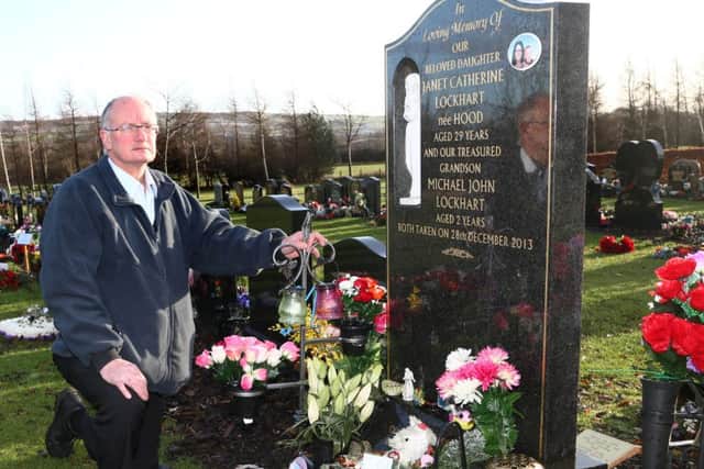 John Hood at the grave of his daughter Janet and grandson Michael who were murdered on December 28th 2013.